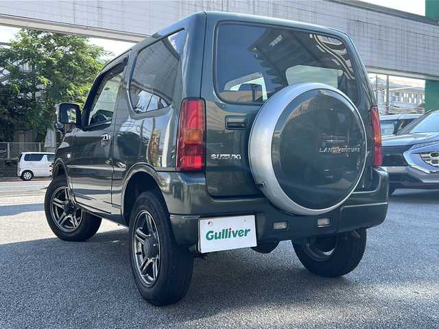 スズキ ジムニー ランドベンチャー 沖縄県 2016(平28)年 5.3万km クールカーキPM 社外ナビ/（ＡＭ／ＦＭ／ＣＤ／ＤＶＤ／ＢＴ）　/フルセグＴＶ　/純正１６インチアルミホイール　/リモコンキー　/ＬＥＤヘッドライト　/ＥＴＣ　/ハーフレザーシート　/シートヒーター　/純正フロアマット　/横滑り防止装置