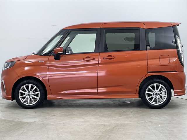スズキ ソリオ HV MZ 道央・札幌 2021(令3)年 9.2万km フレイムオレンジPM ・4WD/・寒冷地仕様/・純正メモリナビ&CD&DVD&BT&USB&フルセグ/・全方位モニター/・両側パワースライドドア/・レーダークルーズコントロール/・衝突軽減ブレーキ/・レーンキープアシスト/・コーナーセンサー/・HUD/・ビルトインETC/・シートヒーター(D/N)/・ドアミラーヒーター/・全席シートカバー/・ウォークスルー/・ステアリングスイッチ/・純正エンジンスターター/・純正前後ドライブレコーダー/・純正フロアマット/・LEDヘッドライト/・LEDフォグランプ/・純正AW付夏タイヤ積載