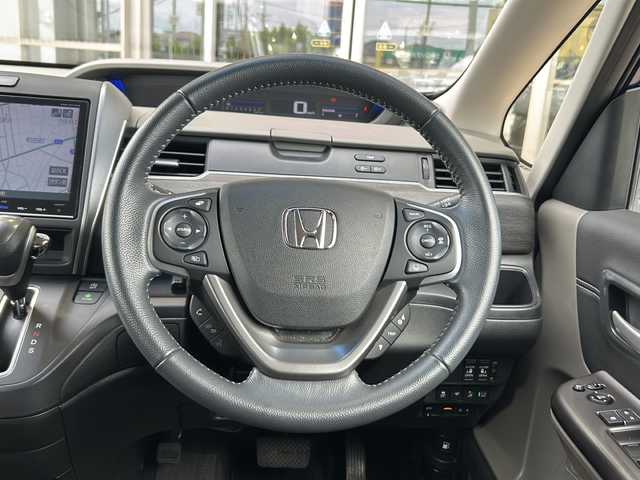 ホンダ フリード G ホンダセンシング 静岡県 2018(平30)年 1.8万km コバルトブルーパール 純正9インチナビ/・CD/DVD/・FM/AM/・フルセグTV/・Music Rack/・SD/・Bluetooth/ホンダセンシング/●衝突軽減ブレーキ〈CMBS〉/●誤発進抑制機能/●ACC〈アダプティブ・クルーズ・コントロール〉/●LKAS〈車線維持支援システム〉/●歩行者事故低減ステアリング/●路外逸脱抑制機能/●先行車発進お知らせ機能/●標識認識機能/主要装備/・両側パワースライドドア　/・レーダークルコン/・ＥＴＣ/・ＬＥＤヘッドライト/・ハーフレザーシート/・レーンキープ/・横滑り防止装置/・純正１５インチアルミ/・本革巻ステアリング/・アイドリングストップ