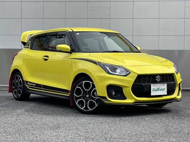 スズキ スイフト スポーツ セーフティPKG 東京都 2019(令1)年 2.8万km チャンピオンイエロー SWKリアウイング/ロッソモデロマフラー/ワンオーナー/社外メモリーナビ/　フルセグTV/DVD/CD/Bluetooth/バックカメラ/デュアルセンサーブレーキサポート/車線逸脱警報/アダプティブクルーズコントロール/ミラー型ドライブレコーダー/LEDヘッドライト/フォグランプ/オートライト/ビルトインETC/シートヒーター/ステアリングスイッチ/プッシュスタート/スマートキー/電動格納ミラー/ウインカーミラー/横すべり防止/フロアマット/ドアバイザー/保証書/取扱説明書