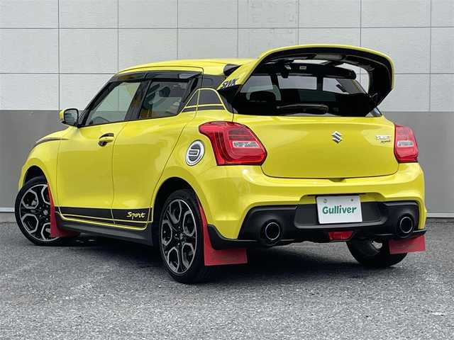 スズキ スイフト スポーツ セーフティPKG 東京都 2019(令1)年 2.8万km チャンピオンイエロー SWKリアウイング/ロッソモデロマフラー/ワンオーナー/社外メモリーナビ/　フルセグTV/DVD/CD/Bluetooth/バックカメラ/デュアルセンサーブレーキサポート/車線逸脱警報/アダプティブクルーズコントロール/ミラー型ドライブレコーダー/LEDヘッドライト/フォグランプ/オートライト/ビルトインETC/シートヒーター/ステアリングスイッチ/プッシュスタート/スマートキー/電動格納ミラー/ウインカーミラー/横すべり防止/フロアマット/ドアバイザー/保証書/取扱説明書