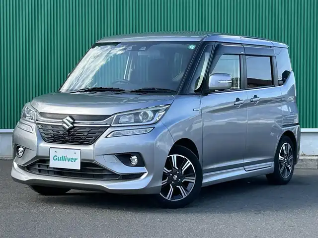 スズキ ソリオ バンディット HV MV 宮城県 2021(令3)年 4.5万km プレミアムシルバーメタリック パワースライドドア（運転席側）/全方位モニター用カメラパッケージ/・フロント/サイド/バックカメラ/・ステアリングスイッチ/・USBソケット/＝＝＝/セーフティサポート/・デュアルカメラブレーキサポート/・後退時ブレーキサポート/・誤発進抑制機能/・後方誤発進抑制機能/・車線逸脱警報機能/・ふらつき警報機能/・先行車発進お知らせ機能/・ハイビームアシスト/・アダプティブクルーズコントロール/リアパーキングセンサー/純正8インチナビ（CN-RZ865）/・CD/DVD/・Bluetooth/・フルセグTV/ビルトインETC/両側パワースライドドア/運転席シートヒーター/革巻きステアリング/パドルシフト/LEDヘッドランプ/フォグランプ/オートライト/スマートキー＆プッシュスタート/電動格納ミラー/純正15インチアルミホイール/純正フロアマット/純正ドアバイザー/W/サイド/カーテンエアバッグ
