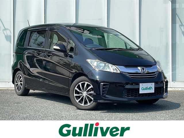 ホンダ フリード G ジャストセレクション 福岡県 2014(平26)年 8.7万km プレミアムスパークルブラックパール 純正７インチナビ　/(バックカメラ/ＴＶ/ＤＶＤ/Ｂｌｕｅｔｏｏｔｈ/ＣＤ)/片側パワースライドドア　/ビルトインＥＴＣ　/横滑り防止装置　/スマートキー　/ドアバイザー　/純正フロアマット