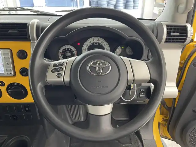 トヨタ ＦＪクルーザー 滋賀県 2011(平23)年 8.9万km イエロー/ホワイト 純正ナビ/バックカメラ/コーナーセンサー/ステアリングスイッチ/キーレス/ヘッドライトレベライザー/カーテンエアバッグ/フロアマット