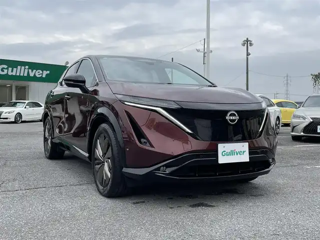 日産 アリア B6 リミテッド 千葉県 2022(令4)年 2万km 赤／黒 プロパイロット2.0/プロパイロットリモートパーキング/パノラミックガラスルーフ/BOSEプレミアムサウンドシステム/ナッパーレザーシート/ヘッドアップディスプレイ/純正12.3インチメモリナビ/インテリジェントアラウンドビューモニター/インテリジェントルームミラー/インテリジェントエマージェンシーブレーキ/ドライバーモニター/前席パワーシート/前席シートベンチレーション/全席シートヒーター/運転席4WAYランバーサポート/インテリジェントBSI/インテリジェントLI/BSW/LDW/リモコンオートバックドア/ステアリングヒーター/ワイヤレス充電器/ETC2.0/純正前後ドライブレコーダー【DH5-S】/サイド＆カーテンエアバッグ