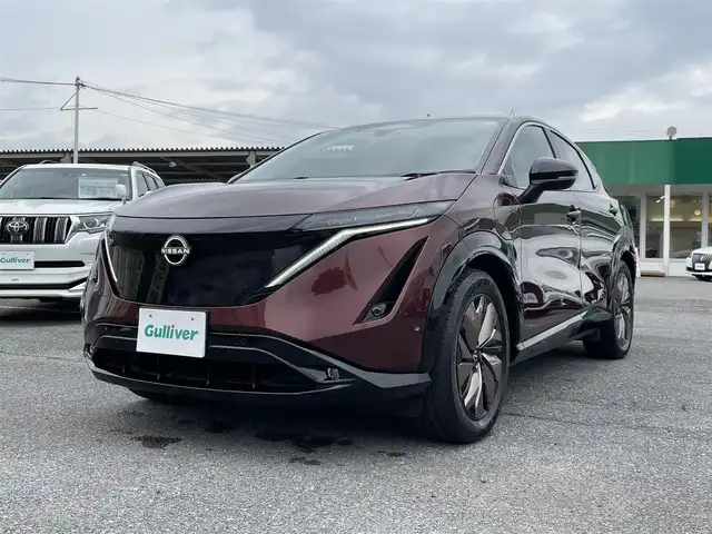 日産 アリア B6 リミテッド 千葉県 2022(令4)年 2万km 赤／黒 プロパイロット2.0/プロパイロットリモートパーキング/パノラミックガラスルーフ/BOSEプレミアムサウンドシステム/ナッパーレザーシート/ヘッドアップディスプレイ/純正12.3インチメモリナビ/インテリジェントアラウンドビューモニター/インテリジェントルームミラー/インテリジェントエマージェンシーブレーキ/ドライバーモニター/前席パワーシート/前席シートベンチレーション/全席シートヒーター/運転席4WAYランバーサポート/インテリジェントBSI/インテリジェントLI/BSW/LDW/リモコンオートバックドア/ステアリングヒーター/ワイヤレス充電器/ETC2.0/純正前後ドライブレコーダー【DH5-S】/サイド＆カーテンエアバッグ