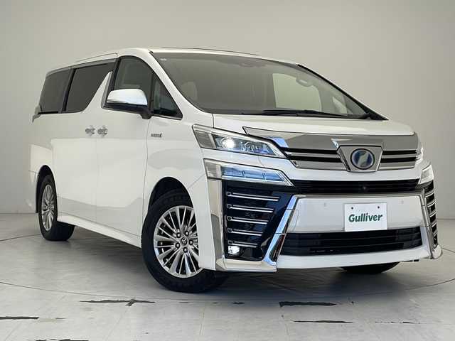 トヨタ ヴェルファイア ハイブリット ZR Gエディション 沖縄県 2019(平31)年 7万km ホワイトパールクリスタルシャイン ダブルサンルーフ　/純正メーカーナビ　/ＪＢＬサウンド　/(フルセグＴＶ　ＤＶＤ再生　ＢＴ接続)/アラウンドビューモニター　/両側パワースライドドア　/パワーバックドア　/デジタルインナーミラー　/黒レザーシート　/パワーシート/シートヒーター /エアシート/オットマン/ステアリングヒーター/AC100V/ETC2.0/LEDオートライト/トヨタセーフティセンス/レーダークルーズコントロール/オートマチックハイビーム/前後クリアランスソナー