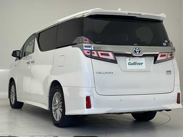 トヨタ ヴェルファイア ハイブリット ZR Gエディション 沖縄県 2019(平31)年 7万km ホワイトパールクリスタルシャイン ダブルサンルーフ　/純正メーカーナビ　/ＪＢＬサウンド　/(フルセグＴＶ　ＤＶＤ再生　ＢＴ接続)/アラウンドビューモニター　/両側パワースライドドア　/パワーバックドア　/デジタルインナーミラー　/黒レザーシート　/パワーシート/シートヒーター /エアシート/オットマン/ステアリングヒーター/AC100V/ETC2.0/LEDオートライト/トヨタセーフティセンス/レーダークルーズコントロール/オートマチックハイビーム/前後クリアランスソナー