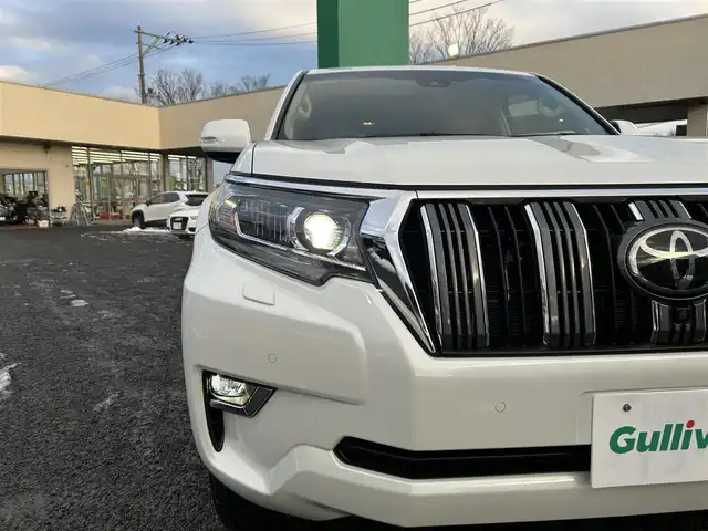 トヨタ ランドクルーザー プラド TX Lパッケージ 宮城県 2023(令5)年 3.8万km ホワイトパールクリスタルシャイン ワンオーナー/純正メーカーナビ/ＡＭ／ＦＭ／Ｂｌｕｅｔｏｏｔｈ／ＵＳＢ/Ｍｉｒａｃａｓｔ/レーダークルーズコントロール/ブラインドスポットモニター/プリクラッシュセーフティ/横滑り防止装置/オートハイビーム/アラウンドビューモニター/シートヒーター/エアーシート/前席パワーシート/セカンドスタートボタン/エンジンスターター/スペアタイヤ/純正フロアマット/純正赤外線カットフィルム/ETC2.0/純正AWサマータイヤ有265/55R19溝4mm