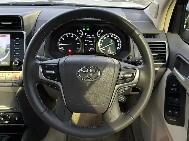 トヨタ ランドクルーザー プラド TX Lパッケージ 宮城県 2023(令5)年 3.8万km ホワイトパールクリスタルシャイン ワンオーナー/純正メーカーナビ/ＡＭ／ＦＭ／Ｂｌｕｅｔｏｏｔｈ／ＵＳＢ/Ｍｉｒａｃａｓｔ/レーダークルーズコントロール/ブラインドスポットモニター/プリクラッシュセーフティ/横滑り防止装置/オートハイビーム/アラウンドビューモニター/シートヒーター/エアーシート/前席パワーシート/セカンドスタートボタン/エンジンスターター/スペアタイヤ/純正フロアマット/純正赤外線カットフィルム/ETC2.0/純正AWサマータイヤ有265/55R19溝4mm