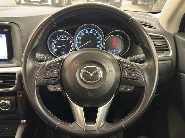 マツダ ＣＸ－５ 25S プロアクティブ 道央・札幌 2015(平27)年 5.6万km クリスタルホワイトパールマイカ ・４ＷＤ/・寒冷地仕様/・マツダ純正ナビ（TV/DVD/AM/FM/BT）/・バックカメラ/・クリアランスソナー/・衝突軽減ブレーキ/・車間認知支援システム/・ブラインドスポットモニタリング/・トラクションコントロール/・どD/AM/FM/BT）/・バックカメラ/・ソナー前後/・衝突軽減ブレーキ/・車間認知支援システム/・ブラインドスポットモニタリング/・トラクションコントロール/・ドライバーアテンションアラート/・クルーズコントロール（追従機能付）/・ステアリングスイッチ/・電動パーキングブレーキ/・ＢＯＳＥサウンドシステム/・ＵＳＢポート×２/・LEDヘッドライト/・フォグランプ/・オートライト/・ヘッドランプウォッシャー/・社外ETC/・社外ドライブレコーダー/・純正エンジンスターター/・スマートキー/・スペアキー/・プッシュスタート