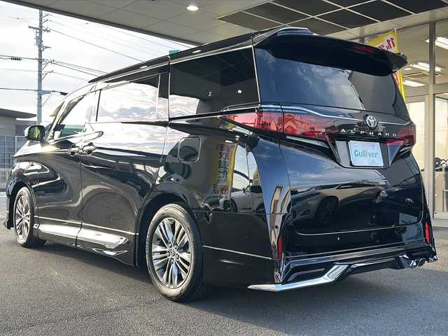トヨタ アルファード Z 愛媛県 2024(令6)年 1万km ブラック ワンオーナー/モデリスタフルエアロ/左右独立ムーンルーフ/14インチディスプレイオーディオ(ナビ/フルセグTV/AM・FM/BT)/14インチフリップダウンモニター/アラウンドビューモニター/ビルトインETC2.0/デジタルインナーミラー/前後ドラレコ/後席用パワーサイドサンシェード/パワーバックドア/置くだけ充電/ステアリングヒーター/シートヒーター(フロント・セカンド)/エアシート(フロント・セカンド)/ステアリング・シート・ドアミラー3メモリー付/ナノイーX(フロント)/純正フロアマット/純正18インチアルミホイール/スペアキー/保証書