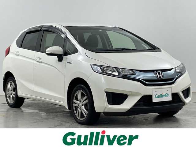 ホンダ フィット ハイブリット Fパッケージ 道央・札幌 2014(平26)年 8.8万km プレミアムホワイトパール ・4WD/ハイブリッド/・社外ナビ  ワンセグ/CD/DVD/・社外ドライブレコーダー/・電動格納ミラー/・純正エンジンスターター/・プッシュスタート/・横滑り防止/ABS/ECON/・社外15インチAW/・オートエアコン/・パワーウィンドウ/・パワーステアリング