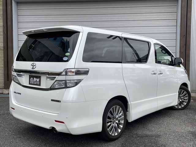 トヨタ ヴェルファイア 2．4Z ゴールデンアイズⅡ 福島県 2014(平26)年 2.1万km ホワイトパールクリスタルシャイン プッシュスタート/パーキングソナー/クルーズコントロール/パノラマモニター/ツインサンルーフ/木目ステアリングスイッチ/両側パワースライドドア/パワーバックドア/２列目オットマン/ハーフレザー/純正１８インチアルミ/純正フロアマット/純正ドライブレコーダー/ETC