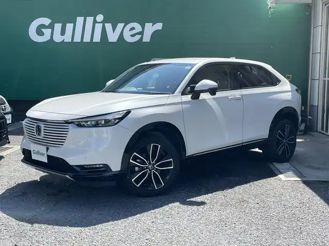 ホンダ ヴェゼル ハイブリッド e:HEV Z 東京都 2021(令3)年 3.3万km プラチナホワイトパール 純正9インチナビ/(フルセグTV/BT）/バックカメラ/ホンダセンシング/・衝突軽減ブレーキ/・誤発進抑制機能/・車線逸脱抑制機能/・追従機能付きアダプティプクルーズコントロール/・先行車発進お知らせ機能/ブラインドスポットモニター/後退時出庫サポート/前席シートヒーター/ステアリングヒーター/電装リアゲート/雨滴検知式フロントワイパー/アクティブコーナリングライト/純正18インチアルミ/置くだけ充電/ETC2.0/保証書/取扱説明書/スペアキー×1