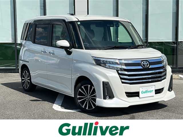 トヨタ ルーミー 岐阜県 2024(令6)年 1万km パールホワイトⅢ 登録時走行距離9752km/純正９型SDナビ/Blue tooth/CD/DVD/iPod/SDミュージックサーバー可　/フルセグテレビ/全方位カメラ　/両側パワースライドドア/ＬＥＤヘッドライト　/オートライト/トヨタセーフティセンス/レーンキープアシスト　/エアバッグW/レーダークルーズコントロール　/コーナーセンサー前後　/ドライブレコーダー前後/横滑り防止装置　/ビルトインＥＴＣ/スマートキー/プッシュスタート/布系シート/シートヒーター前席/フルフラットシート/社外フロアマット/純正15アルミホイール/HDMI入力端子/ドアバイザー/ウィンカーミラー/背面テーブル