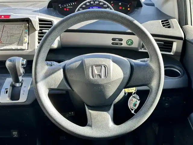 ホンダ フリード Gエアロ 鳥取県 2011(平23)年 15万km アラバスターシルバーメタリック 社外１５インチアルミ/純正メモリナビ/バックカメラ/ワンセグＴＶ　ＳＤ　ＣＤ/フロマアット/ドアバイザー/キーレス/リヤスポイラー