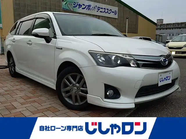 トヨタ カローラ フィールダー HV G エアロツアラー W×B 新潟県 2014(平26)年 10.1万km ホワイトパールクリスタルシャイン (株)IDOMが運営する【じしゃロン新潟店】の自社ローン専用車両になります。/こちらは現金またはオートローンご利用時の価格です。自社ローンご希望の方は別途その旨お申付け下さい/純正ナビ/FM/AM/CD視聴可能/ワンセグTV視聴可能(走行中視聴不可)/Bluetooth/AUX接続可能/バックカメラ/ETC/プッシュスタート/ハーフレザー/純正フロアマット/電動格納ウィンカーミラー/横滑り防止装置/ECO/EVモード/スマートキー