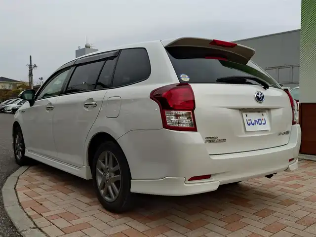 トヨタ カローラ フィールダー HV G エアロツアラー W×B 新潟県 2014(平26)年 10.1万km ホワイトパールクリスタルシャイン (株)IDOMが運営する【じしゃロン新潟店】の自社ローン専用車両になります。/こちらは現金またはオートローンご利用時の価格です。自社ローンご希望の方は別途その旨お申付け下さい/純正ナビ/FM/AM/CD視聴可能/ワンセグTV視聴可能(走行中視聴不可)/Bluetooth/AUX接続可能/バックカメラ/ETC/プッシュスタート/ハーフレザー/純正フロアマット/電動格納ウィンカーミラー/横滑り防止装置/ECO/EVモード/スマートキー