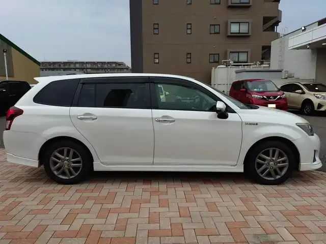 トヨタ カローラ フィールダー HV G エアロツアラー W×B 新潟県 2014(平26)年 10.1万km ホワイトパールクリスタルシャイン (株)IDOMが運営する【じしゃロン新潟店】の自社ローン専用車両になります。/こちらは現金またはオートローンご利用時の価格です。自社ローンご希望の方は別途その旨お申付け下さい/純正ナビ/FM/AM/CD視聴可能/ワンセグTV視聴可能(走行中視聴不可)/Bluetooth/AUX接続可能/バックカメラ/ETC/プッシュスタート/ハーフレザー/純正フロアマット/電動格納ウィンカーミラー/横滑り防止装置/ECO/EVモード/スマートキー