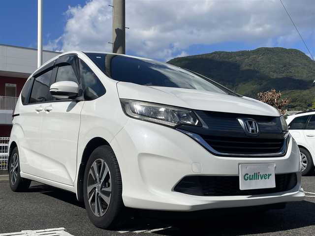 ホンダ フリード G 長崎県 2017(平29)年 7.7万km ホワイトオーキッドパール 純正Gathersインターナビ/・AM/FM/BT/CD/バックカメラ/ステアリングスイッチ/片側パワースライドドア/ビルトインETC/ライトレベライザー/アイドリングストップ/フロアマット/ドアバイザー/保証書/取扱説明書/ナビ取扱説明書/スペアキー