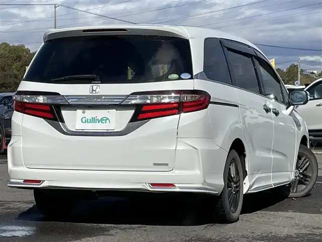 ホンダ オデッセイ アブソルート・EXホンダセンジング 道央・札幌 2017(平29)年 17.3万km ホワイトオーキッドパール ４WD/ワンオーナー/純正メーカーナビ/CD/DVD/BT/フルセグ/純正フリップダウンモニター/ホンダセンシング/衝突被害軽減ブレーキ/横滑り防止装置/アダプティブクルーズコントロール/レーンキープアシスト/パーキングアシスト/ブラインドスポットモニター/全方位カメラ/ビルトインETC/ドライブレコーダー/アイドリングストップ/D席パワーシート/ハーフレザーシート/革巻きステアリング/ステアリングリモコン/パドルシフト/レーダー探知機/プッシュスタート/スマートキー/LEDヘッドライト/オートライト/フォグランプ/電動格納ミラー/ウィンカーミラー/純正フロアマット/ドアバイザー/純正エンジンスターター