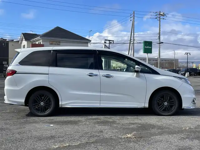 ホンダ オデッセイ アブソルート・EXホンダセンジング 道央・札幌 2017(平29)年 17.3万km ホワイトオーキッドパール ４WD/ワンオーナー/純正メーカーナビ/CD/DVD/BT/フルセグ/純正フリップダウンモニター/ホンダセンシング/衝突被害軽減ブレーキ/横滑り防止装置/アダプティブクルーズコントロール/レーンキープアシスト/パーキングアシスト/ブラインドスポットモニター/全方位カメラ/ビルトインETC/ドライブレコーダー/アイドリングストップ/D席パワーシート/ハーフレザーシート/革巻きステアリング/ステアリングリモコン/パドルシフト/レーダー探知機/プッシュスタート/スマートキー/LEDヘッドライト/オートライト/フォグランプ/電動格納ミラー/ウィンカーミラー/純正フロアマット/ドアバイザー/純正エンジンスターター