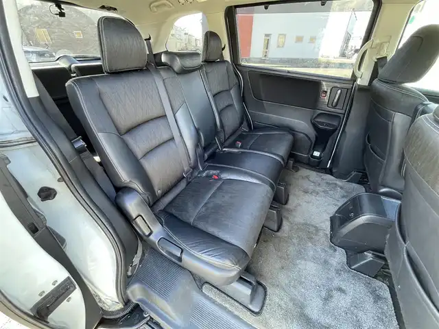 ホンダ オデッセイ アブソルート・EXホンダセンジング 道央・札幌 2017(平29)年 17.3万km ホワイトオーキッドパール ４WD/ワンオーナー/純正メーカーナビ/CD/DVD/BT/フルセグ/純正フリップダウンモニター/ホンダセンシング/衝突被害軽減ブレーキ/横滑り防止装置/アダプティブクルーズコントロール/レーンキープアシスト/パーキングアシスト/ブラインドスポットモニター/全方位カメラ/ビルトインETC/ドライブレコーダー/アイドリングストップ/D席パワーシート/ハーフレザーシート/革巻きステアリング/ステアリングリモコン/パドルシフト/レーダー探知機/プッシュスタート/スマートキー/LEDヘッドライト/オートライト/フォグランプ/電動格納ミラー/ウィンカーミラー/純正フロアマット/ドアバイザー/純正エンジンスターター