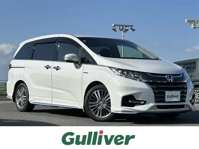 ホンダ オデッセイ ハイブリッド アブソルート・EXホンダセンジング 島根県 2019(平31)年 3.6万km プラチナホワイトパール 純正9インチナビ/CD/DVD/DTV/Bluetooth/HDMI/マルチビューカメラ /純正フリップダウンモニター/両側パワースライドドア/レーダークルーズコントロール/純正17インチアルミホイール/シートカバー/シートヒーター/コーナーセンサー /スマートキー/プッシュスタート /LEDオートライト/ドライブレコーダー/ビルトインETC2.0/大型アームレスト/純正フロアマット/ドアバイザー