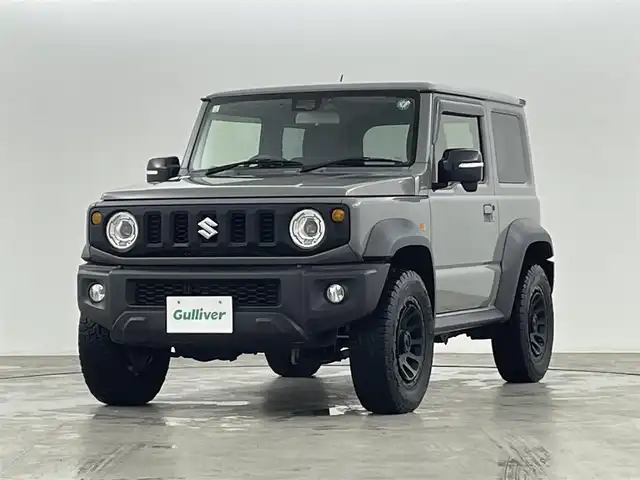 スズキ ジムニー シエラ JC 福島県 2021(令3)年 3.5万km ミディアムグレー ４WD/ワンオーナー/純正SDナビ/ 【BT/CD/DVD/フルセグTV/AM/FM】/プッシュスタート/クルーズコントロール/ステアリングスイッチ/シートヒーター/ (D席/N席）/ビルトインETC/ドライブレコーダー/フロアマット/電動格納ミラー/ドアバイザー/オートライト/LEDヘッドライト/・フォグランプ/背面タイヤ/社外16インチAW/スマートキー/。スペアキー/ダウンヒルアシストコントロール/レーンキープアシスト/衝突被害軽減システム/・保証書/・取扱説明書
