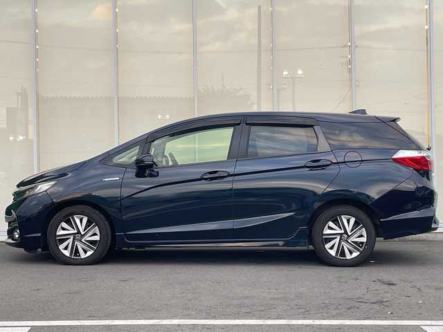 ホンダ シャトル ハイブリッド X ホンダセンシング 神奈川県 2017(平29)年 6.3万km ミッドナイトブルービームM 純正ナビ（VXM-184VFi）/ワンセグ/CD/DVD//追従クルーズコントロール　/バックカメラ　/シートヒーター　/ビルドインＥＴＣ　/ドライブレコーダー　/ＬＥＤヘッドライト　/フォグライト　/オートライト　/スマートキー/スペアキー　/純正アルミホイール/純正フロアマット/ABS/横滑り防止装置/衝突被害軽減システム/保証書/取扱説明書/記録簿