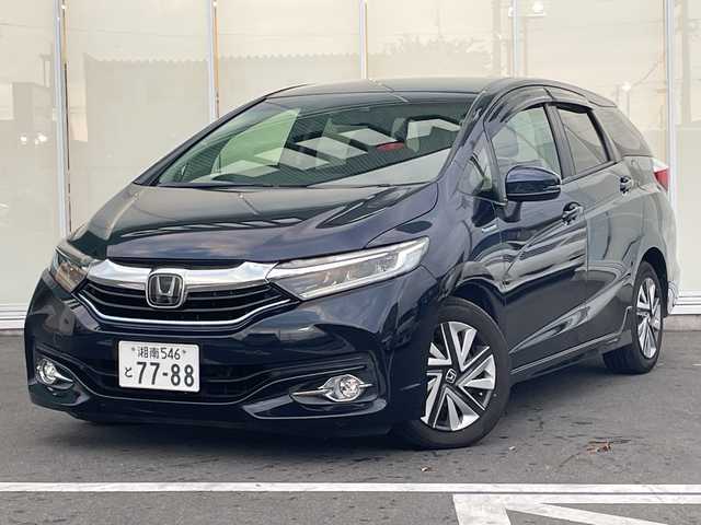 ホンダ シャトル ハイブリッド X ホンダセンシング 神奈川県 2017(平29)年 6.3万km ミッドナイトブルービームM 純正ナビ（VXM-184VFi）/ワンセグ/CD/DVD//追従クルーズコントロール　/バックカメラ　/シートヒーター　/ビルドインＥＴＣ　/ドライブレコーダー　/ＬＥＤヘッドライト　/フォグライト　/オートライト　/スマートキー/スペアキー　/純正アルミホイール/純正フロアマット/ABS/横滑り防止装置/衝突被害軽減システム/保証書/取扱説明書/記録簿