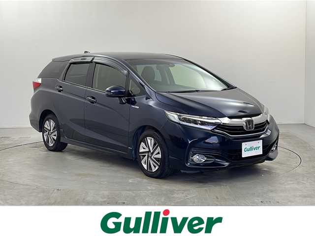 ホンダ シャトル ハイブリッド X ホンダセンシング 栃木県 2017(平29)年 6.3万km ミッドナイトブルービームM 純正ナビ（VXM-184VFi）/（BT/ワンセグ/CD/DVD/AM/FM)/衝突軽減システム/追従クルーズコントロール　/横滑り防止/先行車発進お知らせ/標識認識機能/車線逸脱抑制機能/バックカメラ　/シートヒーター　/ビルドインＥＴＣ　/ドライブレコーダー　/ＬＥＤヘッドライト　/ステアリングスイッチ/プッシュスタート/スマートキー/スペアキー　/純正アルミホイール/純正フロアマット