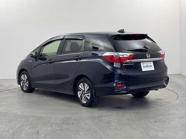 ホンダ シャトル ハイブリッド X ホンダセンシング 栃木県 2017(平29)年 6.3万km ミッドナイトブルービームM 純正ナビ（VXM-184VFi）/（BT/ワンセグ/CD/DVD/AM/FM)/衝突軽減システム/追従クルーズコントロール　/横滑り防止/先行車発進お知らせ/標識認識機能/車線逸脱抑制機能/バックカメラ　/シートヒーター　/ビルドインＥＴＣ　/ドライブレコーダー　/ＬＥＤヘッドライト　/ステアリングスイッチ/プッシュスタート/スマートキー/スペアキー　/純正アルミホイール/純正フロアマット