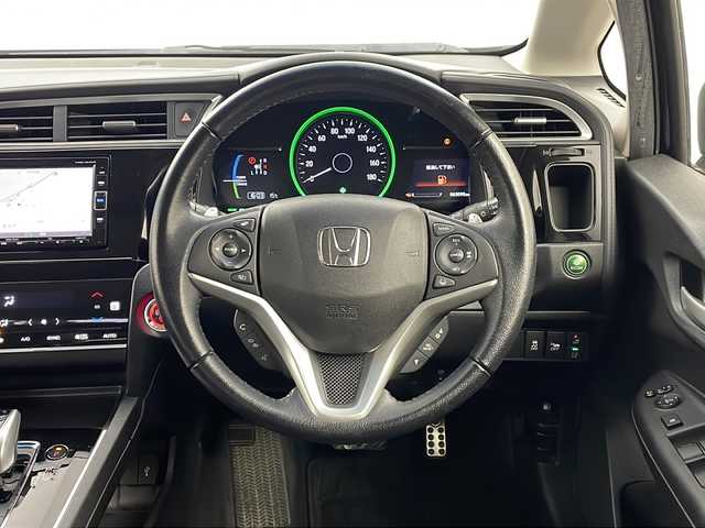 ホンダ シャトル ハイブリッド X ホンダセンシング 栃木県 2017(平29)年 6.3万km ミッドナイトブルービームM 純正ナビ（VXM-184VFi）/（BT/ワンセグ/CD/DVD/AM/FM)/衝突軽減システム/追従クルーズコントロール　/横滑り防止/先行車発進お知らせ/標識認識機能/車線逸脱抑制機能/バックカメラ　/シートヒーター　/ビルドインＥＴＣ　/ドライブレコーダー　/ＬＥＤヘッドライト　/ステアリングスイッチ/プッシュスタート/スマートキー/スペアキー　/純正アルミホイール/純正フロアマット