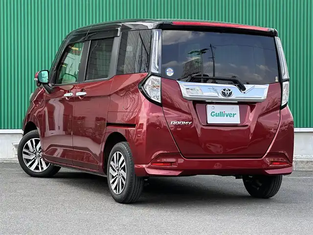 トヨタ ルーミー カスタムG 宮城県 2022(令4)年 1.6万km ブラックマイカメタリック/ファイアークォーツレッドメタリック パノラミックビュー対応ナビレディパッケージ/・パノラミックビューモニター/・ステアリングスイッチ/コンフォートパッケージ/・シートヒーター/・シートバックテーブル/＝＝＝/スマートアシスト/・衝突警報機能/・衝突回避支援ブレーキ機能/・車線逸脱警報機能/・ブレーキ制御付誤発進抑制機能/・先行車発進お知らせ機能/・アダプティブドライビングビーム/・アダプティブクルーズコントロール/・ふらつき警報/・サイドビューランプ/・コーナーセンサー/・路側逸脱警報/・標識認識機能/純正9インチナビ/フルセグTV/Bluetooth/CD/DVD/SD/HDMI/TV-KIT/前後ドライブレコーダー/ビルトインETC2.0/両側パワースライドドア/LEDヘッドライト/LEDフォグランプ/電動パーキング/ステアリングスイッチ/革巻ステアリング/純正14インチAW/フロアマット/ドアバイザー/保証書/取扱説明書/スペアキー