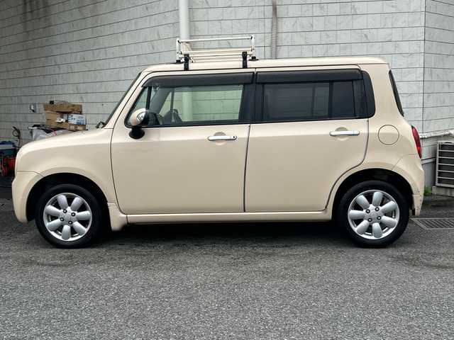 スズキ ラパン X セレクション 神奈川県 2013(平25)年 9.5万km ミルクティーベージュメタリック 社外ナビ/LEDライト/オートライト/純正フロアマット/アイドリングストップ/シートヒーター/ルーフキャリア/純正14インチAW/社外オーディオ/【ラジオ/CD/AUX】/スペアキー/新車時保証書/取扱説明書