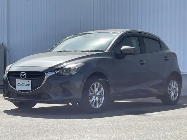 マツダ デミオ 13S 愛媛県 2017(平29)年 0.9万km マシーングレープレミアムM ワンオーナー　/マツダコネクトナビ　/フルセグＴＶ　/ＬＥＤオートライト　/前席シートヒーター　/ＥＴＣ　/革巻ステアリング　/スマートキー２本　/純正１５インチアルミホイール　/純正フロアマット　/保証書　/取扱説明書/ナビ取説