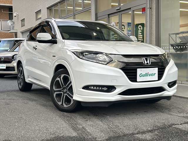 ホンダ ヴェゼル ハイブリッド Z ホンダセンシング 高知県 2017(平29)年 9.3万km ホワイトオーキッドパール ホンダセンシング/純正9インチナビ/（Bluetoothオーディオ/フルセグTV/CD/DVD）/アップルカープレイ/バックカメラ/ETC/ドラレコ/シートヒーター/オートライト/ステアリングスイッチ/クルコン/スマートキー/純正フロアマット