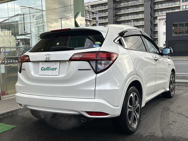 ホンダ ヴェゼル ハイブリッド Z ホンダセンシング 高知県 2017(平29)年 9.3万km ホワイトオーキッドパール ホンダセンシング/純正9インチナビ/（Bluetoothオーディオ/フルセグTV/CD/DVD）/アップルカープレイ/バックカメラ/ETC/ドラレコ/シートヒーター/オートライト/ステアリングスイッチ/クルコン/スマートキー/純正フロアマット