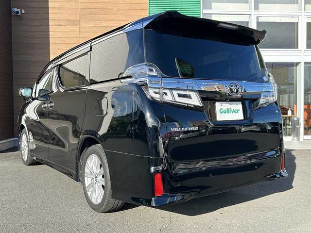 トヨタ ヴェルファイア Z Aエディション 静岡県 2019(平31)年 5.8万km ブラック 純正ディーラーOPナビ【CD/DVD/BT/フルセグTV】/純正フリップダウンモニター/トヨタセーフティセンス/プリクラッシュセーフティ/横滑り防止装置/レーダークルーズコントロール/バックカメラ/ビルトインETC/ドライブレコーダー/アイドリングストップ/GPS（Laser)/ECOMODE/両側パワースライドドア/N席/２列目オットマン/ブレーキホールド/MTモード付AT/プッシュスタート/スマートキー/LEDヘッドライト/オートライト/フォグランプ/電動格納ミラー/ウィンカーミラー/純正フロアマット/ドアバイザー/スペアキー１