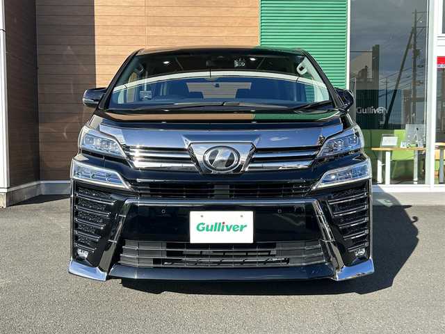 トヨタ ヴェルファイア Z Aエディション 静岡県 2019(平31)年 5.8万km ブラック 純正ディーラーOPナビ【CD/DVD/BT/フルセグTV】/純正フリップダウンモニター/トヨタセーフティセンス/プリクラッシュセーフティ/横滑り防止装置/レーダークルーズコントロール/バックカメラ/ビルトインETC/ドライブレコーダー/アイドリングストップ/GPS（Laser)/ECOMODE/両側パワースライドドア/N席/２列目オットマン/ブレーキホールド/MTモード付AT/プッシュスタート/スマートキー/LEDヘッドライト/オートライト/フォグランプ/電動格納ミラー/ウィンカーミラー/純正フロアマット/ドアバイザー/スペアキー１