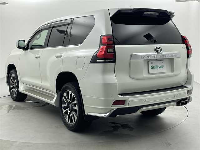 トヨタ ランドクルーザー プラド TX Lパッケージ 福井県 2023(令5)年 1.8万km ホワイトパールクリスタルシャイン 純正ナビ機能付きディスプレイオーディオ/（FM/AM/Bluetooth/AppleCarPlay//AndroidAuto)/アラウンドビューモニター/モデリスタエアロ/サンルーフ/黒革シート /エアシート/社外フロアマット/純正アルミホイール/前後コーナーセンサ―/盗難防止装置/純正ビルトインETC