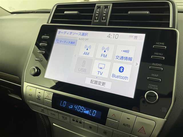トヨタ ランドクルーザー プラド TX Lパッケージ 福井県 2023(令5)年 1.8万km ホワイトパールクリスタルシャイン 純正ナビ機能付きディスプレイオーディオ/（FM/AM/Bluetooth/AppleCarPlay//AndroidAuto)/アラウンドビューモニター/モデリスタエアロ/サンルーフ/黒革シート /エアシート/社外フロアマット/純正アルミホイール/前後コーナーセンサ―/盗難防止装置/純正ビルトインETC