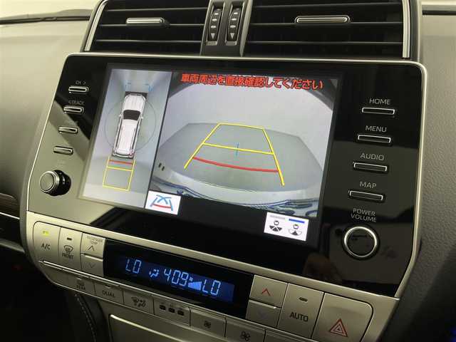 トヨタ ランドクルーザー プラド TX Lパッケージ 福井県 2023(令5)年 1.8万km ホワイトパールクリスタルシャイン 純正ナビ機能付きディスプレイオーディオ/（FM/AM/Bluetooth/AppleCarPlay//AndroidAuto)/アラウンドビューモニター/モデリスタエアロ/サンルーフ/黒革シート /エアシート/社外フロアマット/純正アルミホイール/前後コーナーセンサ―/盗難防止装置/純正ビルトインETC