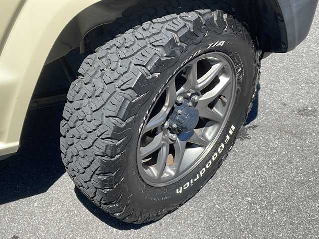 スズキ ジムニー XC 長野県 2020(令2)年 2.3万km シフォンアイボリーM ４WD/レーダーブレーキ /パイオニア8インチナビフルセグTV/バックカメラ/ETC/純正16インチアルミ/オールテレインタイヤ/社外AW付きタイヤ積込/ルーフキャリア/社外グリル/背面ラダー/保証書・取説