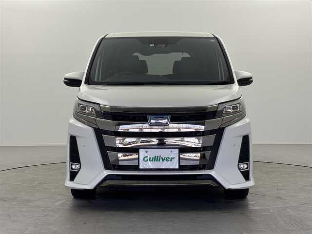 トヨタ ノア ハイブリッド Si ダブルバイビーⅡ 福井県 2020(令2)年 2万km ホワイトパールクリスタルシャイン トヨタセーフティーセンス/・プリクラッシュセーフティ/・レーンディパーチャーアラート/・オートハイビーム/クルーズコントロール/純正10インチナビ/・CD.DVD.SD.BT/フルセグTV/バックモニター/ハーフレザーシート/・前席シートヒーター/LEDヘッドライト/フォグランプ/アイドリングストップ/横滑り防止装置/ビルトインETC/ステアリングスイッチ/プッシュスタート/スマートキー/純正16インチアルミホイール/純正フロアマット/後席ロールサンシェード/シートバックテーブル