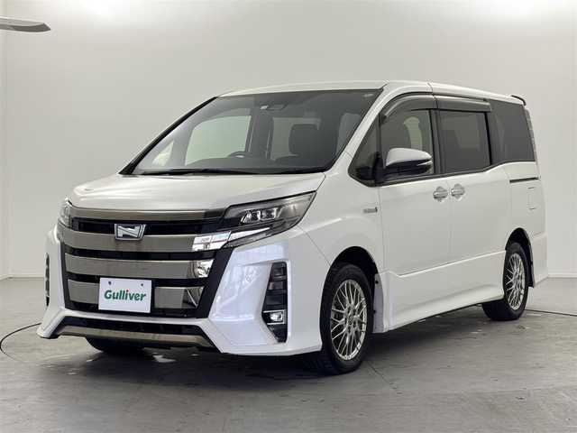 トヨタ ノア ハイブリッド Si ダブルバイビーⅡ 福井県 2020(令2)年 2万km ホワイトパールクリスタルシャイン トヨタセーフティーセンス/・プリクラッシュセーフティ/・レーンディパーチャーアラート/・オートハイビーム/クルーズコントロール/純正10インチナビ/・CD.DVD.SD.BT/フルセグTV/バックモニター/ハーフレザーシート/・前席シートヒーター/LEDヘッドライト/フォグランプ/アイドリングストップ/横滑り防止装置/ビルトインETC/ステアリングスイッチ/プッシュスタート/スマートキー/純正16インチアルミホイール/純正フロアマット/後席ロールサンシェード/シートバックテーブル