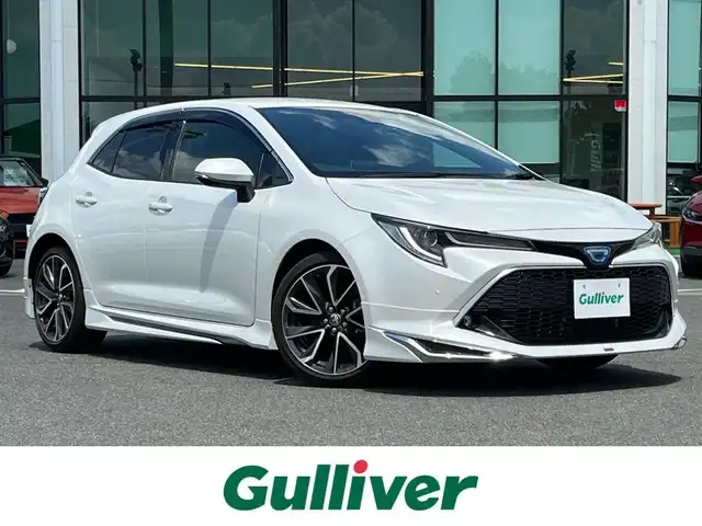 トヨタ カローラ スポーツ ハイブリッドG Z 奈良県 2022(令4)年 3.3万km プラチナホワイトパールマイカ モデリスタエアロ　/メーカーナビ　/(AppleCarPlay/BT/Miracast)/フルセグＴＶ　/バックカメラ　/レーダークルーズコントロール　/衝突被害軽減システム　/ハーフレザーシート　/前席シートヒーター /前後ドライブレコーダー /車線逸脱警報/LEDヘッドライト