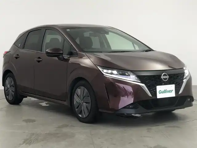 日産 ノート X 愛知県 2021(令3)年 4.5万km バーガンディー 純正9インチワイドディスプレイオーディオ/フルセグTV/USBポート/ドライブレコーダー/デジタルインナーミラー/ワイヤレス充電器/ステアリングリモコン/プロパイロット/インテリジェントエマージェンシーブレーキ/踏み間違い衝突防止アシスト/車線逸脱警報/ビークルダイナミクスコントロール/全方位運転支援システム/レーダークルーズコントロール/BSM/ビルトインETC/取扱説明書/スマートキー